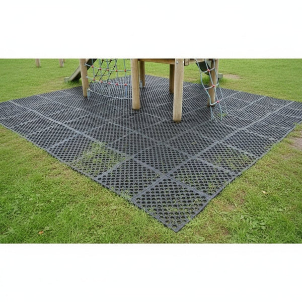 Rubber grass mat at playground providing safe accessible ground