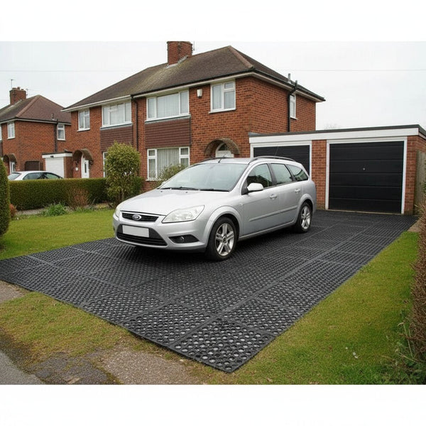 Heavy duty rubber mats supporting vehicle weight on grass