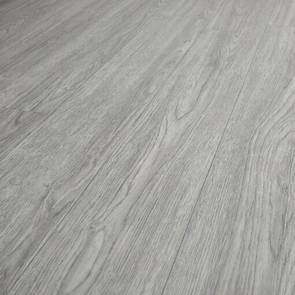 Washed grey self-adhesive vinyl plank flooring texture close-up