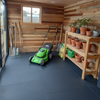 Shed Rubber Mats installed in British garden shed with tools and lawnmower