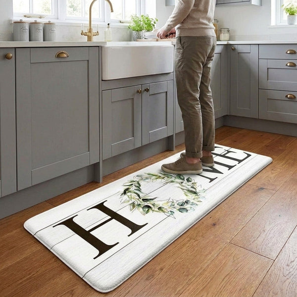 Anti-fatigue mat in UK modern kitchen with person standing cooking