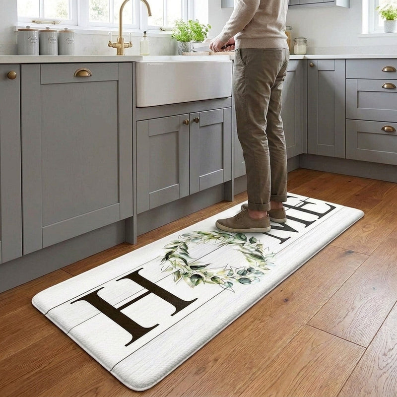 Anti-fatigue mat in UK modern kitchen with person standing cooking