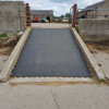 Grip Top Round Stud Rubber Tile on UK farm collecting yard ramp
