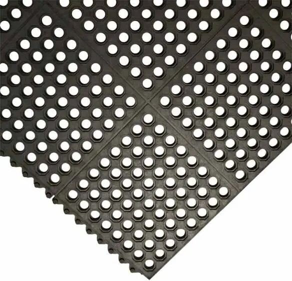 Rubber grass mat drainage holes close-up interlocking detail