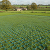 Green X-Grid permeable grass grid installed as overflow parking area at UK countryside venue