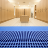 Spa changing room drainage tiles UK - non-slip wet area floor mats wellness centre
