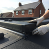 EPDM rubber roof corner piece installation on flat roof extension UK