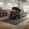 Rubber wash bay mat in British MOT garage - mechanic workshop wet floor protection