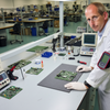 Anti-static ESD workbench mat in British electronics factory - circuit board assembly station UK