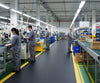 Anti-fatigue mat with yellow borders on long edges - production line