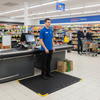 ErgoStand Pro bubble top mat at UK supermarket checkout - retail standing comfort mat