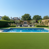 Non-slip artificial grass around luxury UK swimming pool with loungers
