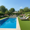Non-slip artificial grass around luxury UK swimming pool with loungers