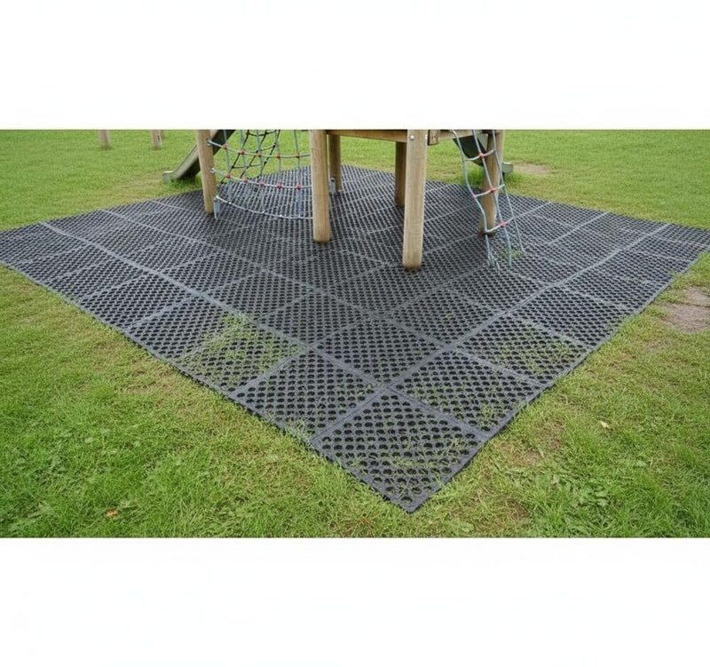 Heavy duty rubber grass mats installed beneath playground climbing frame UK