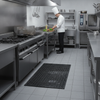 Recycled Rubber Honeycomb Door Mat with Drainage Holes - Commercial Kitchen Setting