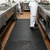 Anti-slip rubber drainage mat in commercial kitchen — 10mm black rubber safety matting for wet areas and food preparation environments