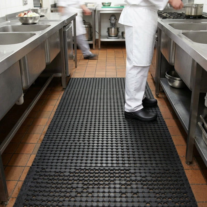 Anti-slip rubber drainage mat in commercial kitchen — 10mm black rubber safety matting for wet areas and food preparation environments