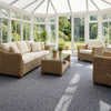 Carpet tiles in UK conservatory with wicker furniture