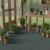 Greenhouse Rubber Mats installed on floor with potting bench and plants