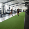 Indoor sprint track installed in PT studio with personal trainer