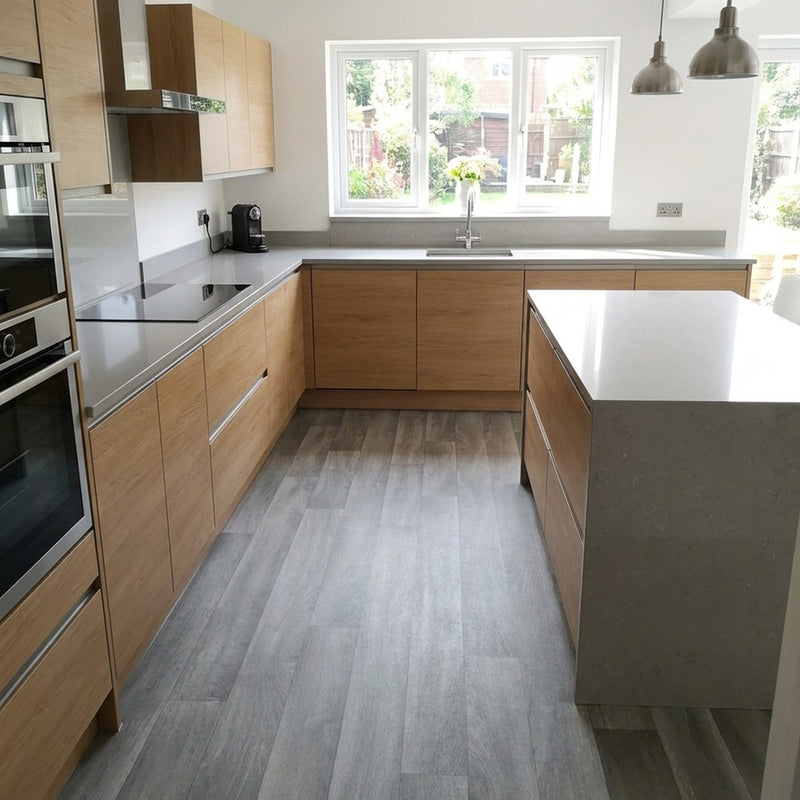 Grey oak vinyl lino roll installed in modern UK kitchen