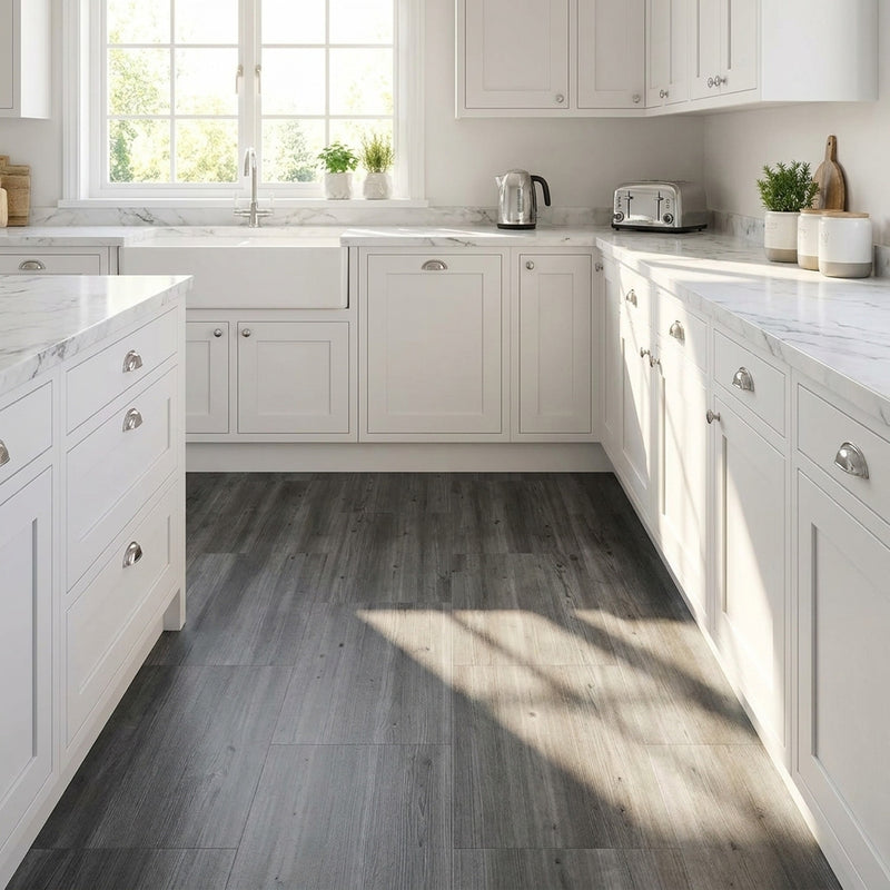 Grey wood effect peel and stick vinyl tiles in UK kitchen with white cabinets