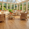 Honey oak self-adhesive vinyl planks in UK conservatory