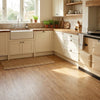 Honey oak vinyl planks in UK kitchen with cream shaker cabinets