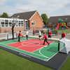 MUGA Surfacing Sports Court Tiles installed at UK school playground with children playing sports