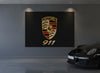 Porsche 911 rug hung as wall art in a dark grey garage next to a black 911