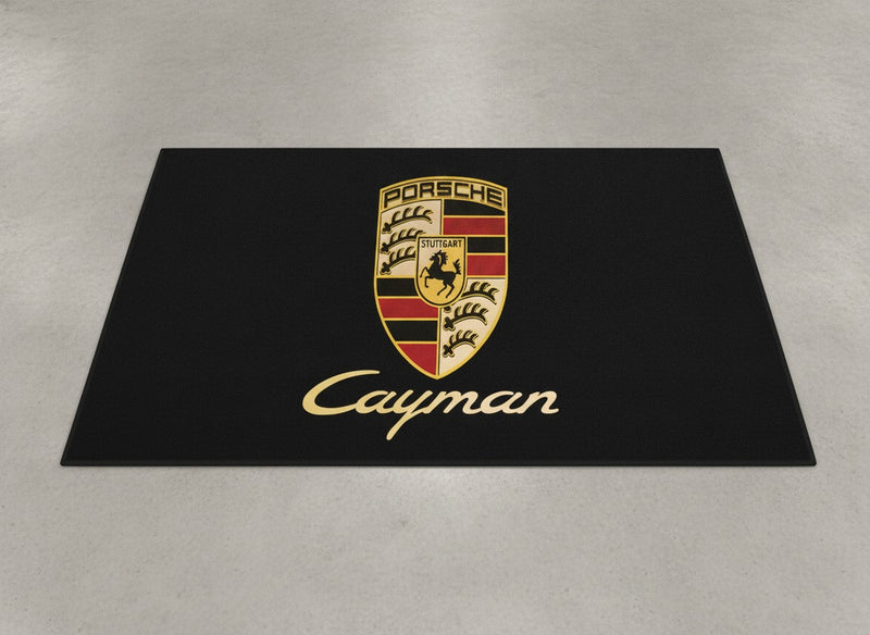 Porsche Cayman showroom parking rug laid on light grey polished concrete