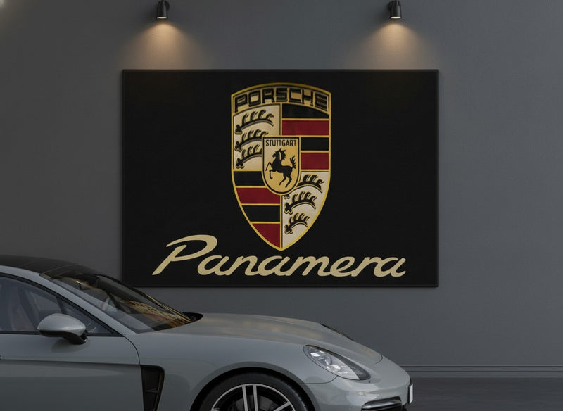 Porsche Panamera rug hung as wall art in a charcoal garage above a parked Panamera