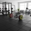 ProMat Heavy Duty Rubber Flooring in weightlifting area with Olympic barbells