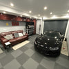 Graphite grey PVC garage floor tiles in professional workshop
