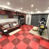Racing red PVC garage floor tiles in sports car garage