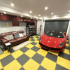 Racing yellow PVC garage floor tiles in professional detailing bay