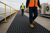 Heavy-duty open ring roof matting walkway with worker on rooftop