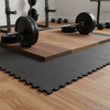 Rubber gym mats under deadlift platform with heavy weight plates