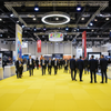 Yellow EVA foam interlocking floor tiles at vibrant exhibition event space