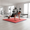 Red Blue EVA Foam Exercise Mats in Home Gym - Person Doing Burpees