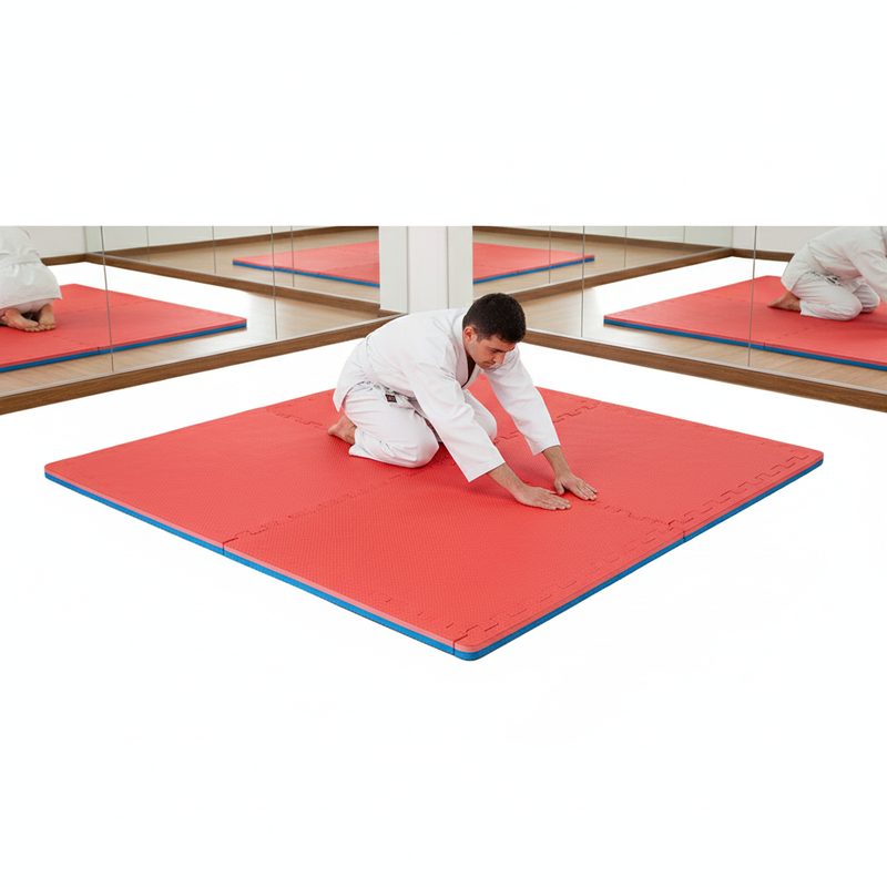 Red Blue EVA Foam Mats in Martial Arts Dojo - Person in Gi Stretching
