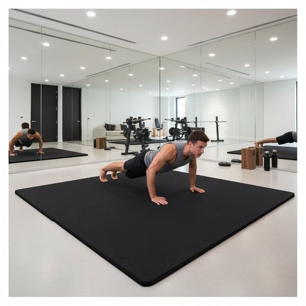 Black 20mm EVA foam exercise mats in home gym - person doing push-ups on black interlocking mats