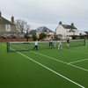 Multi-sport artificial grass backyard tennis court UK home