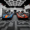 Vented floor tiles in F1 motorsport racing team garage UK