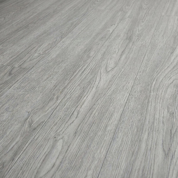 Washed grey self-adhesive vinyl plank flooring texture close-up