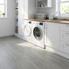 Washed grey self-adhesive vinyl planks in UK utility room